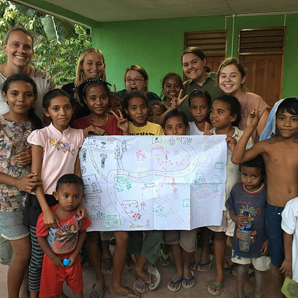 Haley and others at a Girl’s Club Meeting where they completed a community map