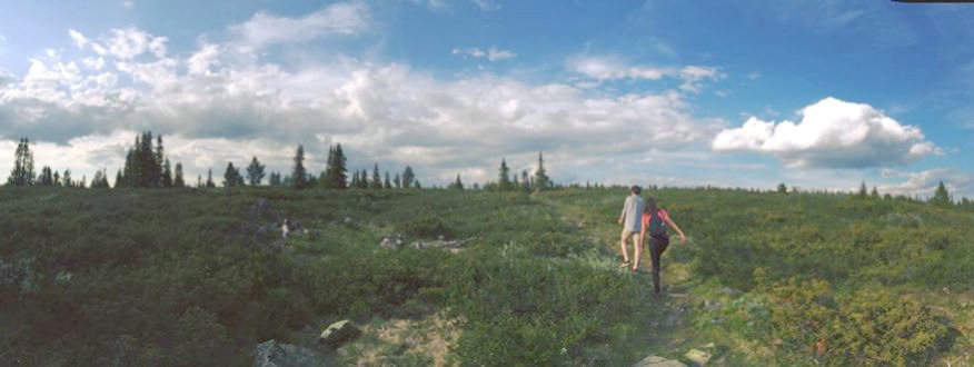 Summer School Excursions - Two students hiking on a hill