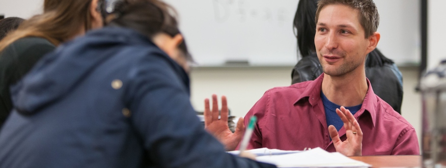 Professor Bret Underwood talks with students.