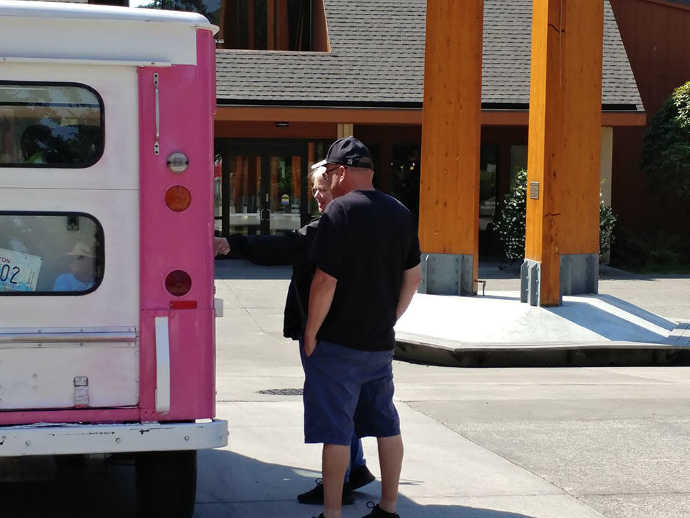 Staff at the ice cream truck picking out their ice cream treats