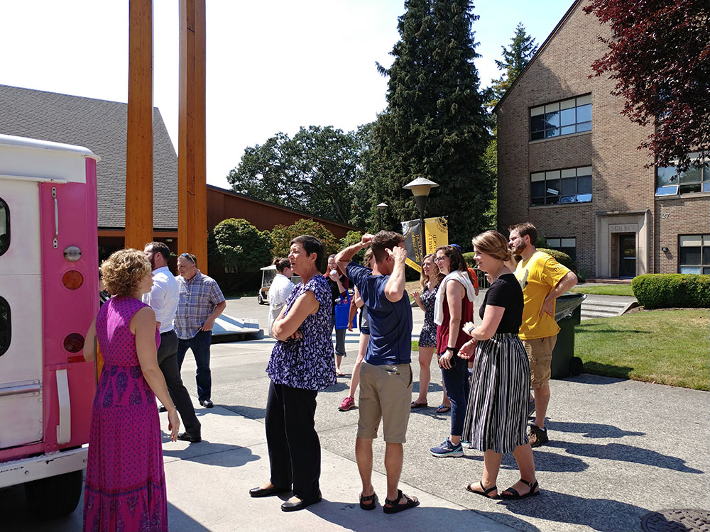 Staff at the ice cream truck picking out their ice cream treats