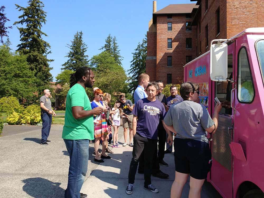 Staff at the ice cream truck picking out their ice cream treats