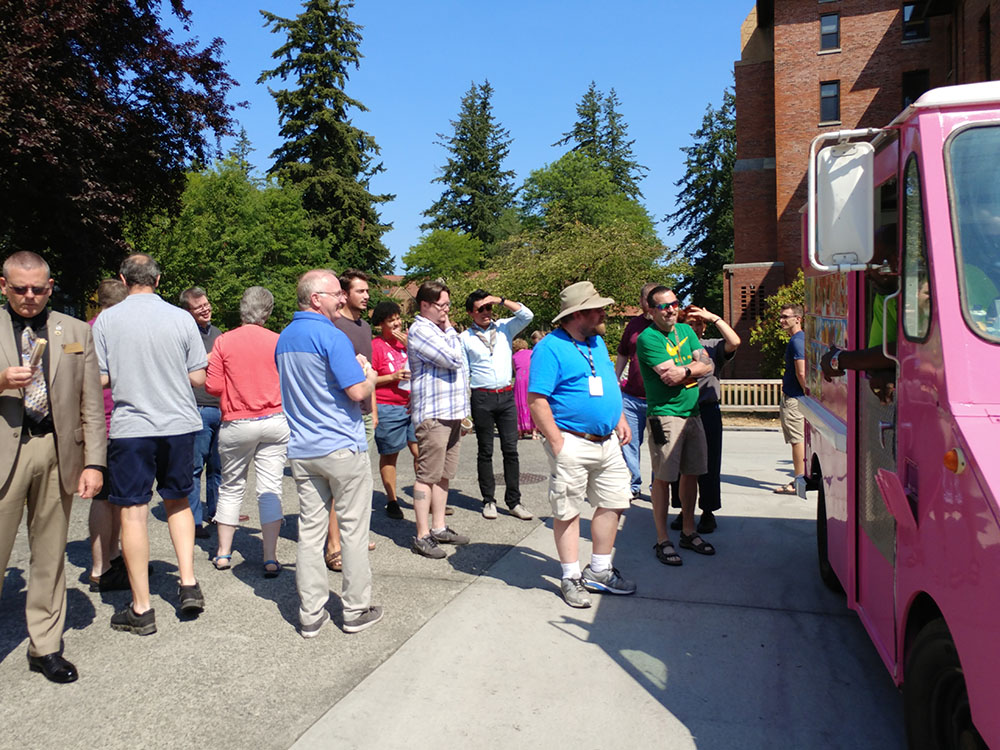 Staff at the ice cream truck picking out their ice cream treats