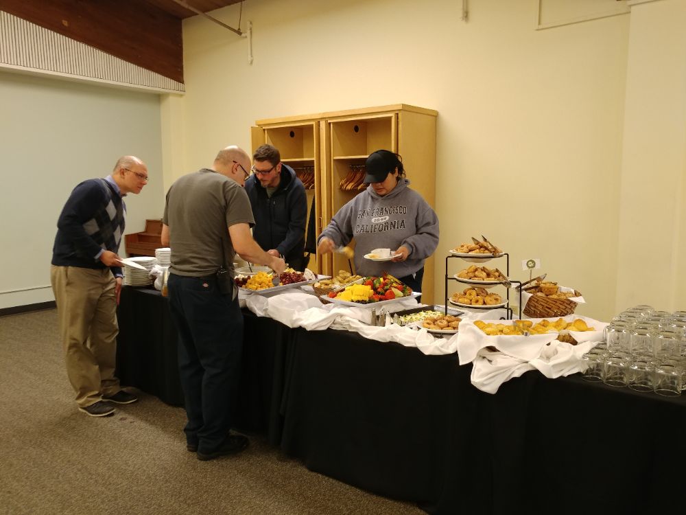 Staff selecting and eating food