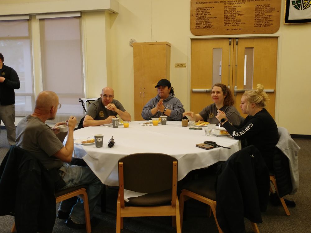 Staff selecting and eating food