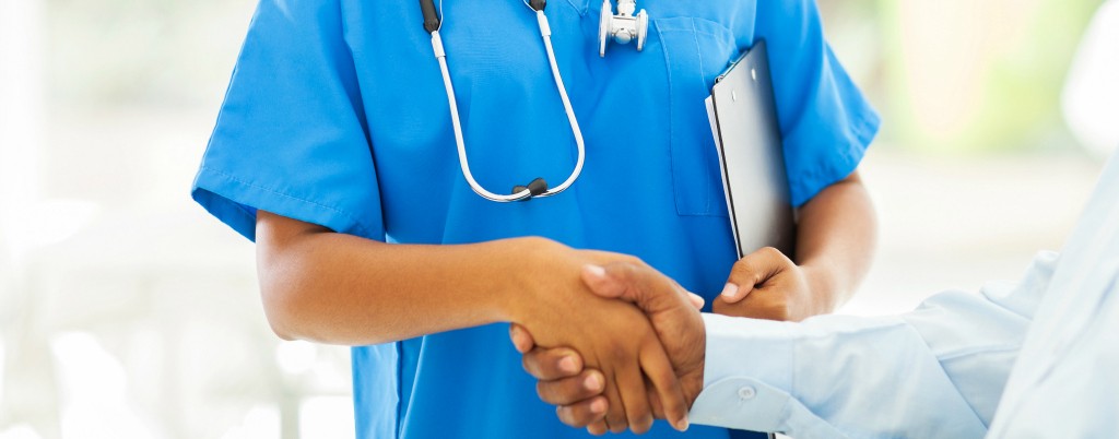 close up of doctor shaking patients hand