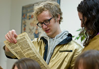 student looking at old printed page