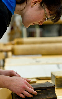 student looking at a really old book