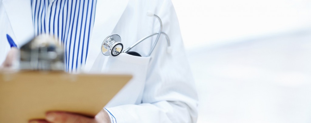 Pre-PA up close photo of doctor writing on chart