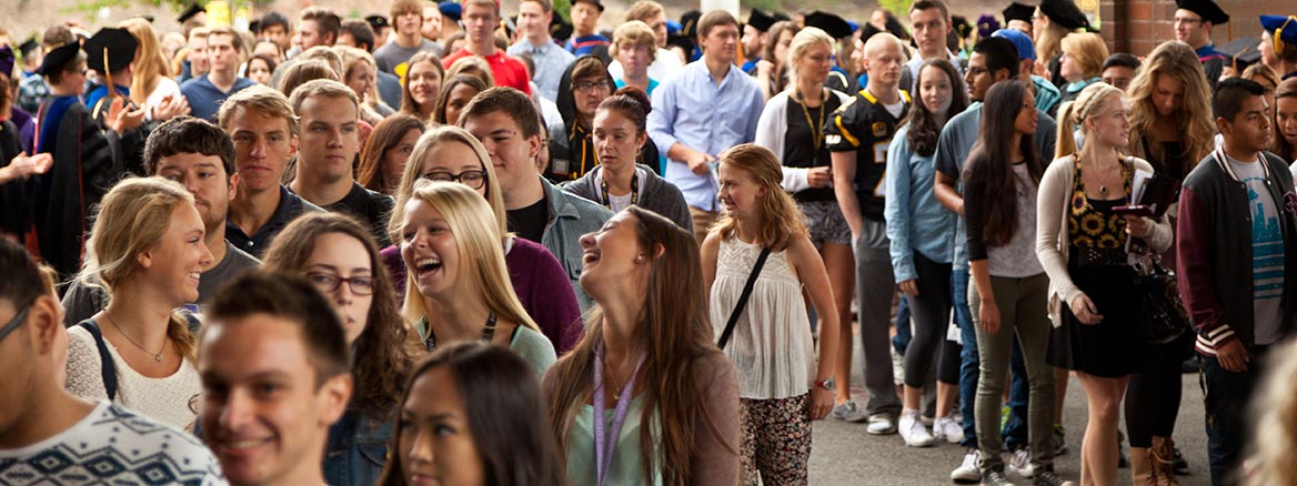 2014 Convocation, students filing in to Olson