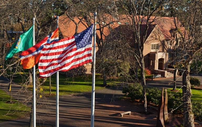3 Flags blow in the wind on campus
