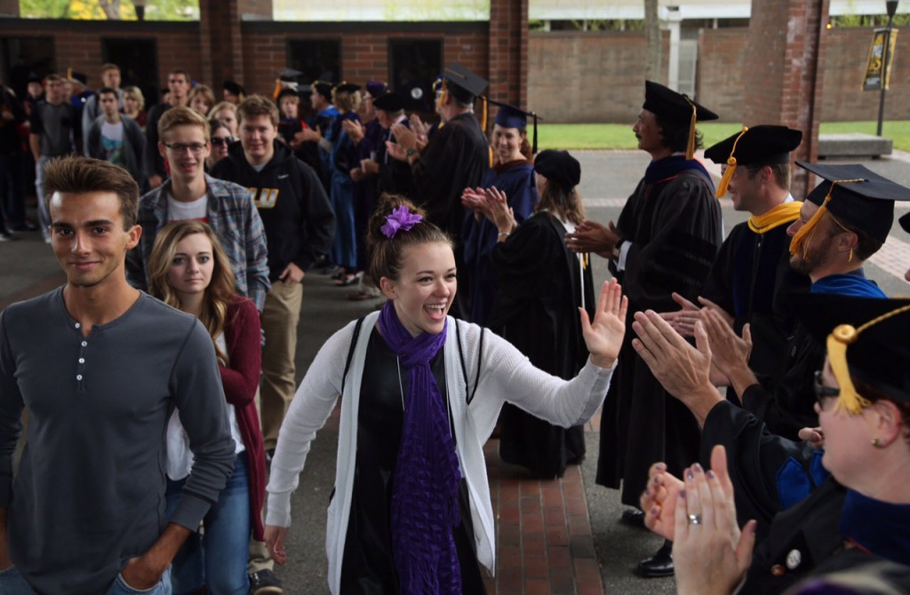 Convocation processional - students filing into Olson Auditorium