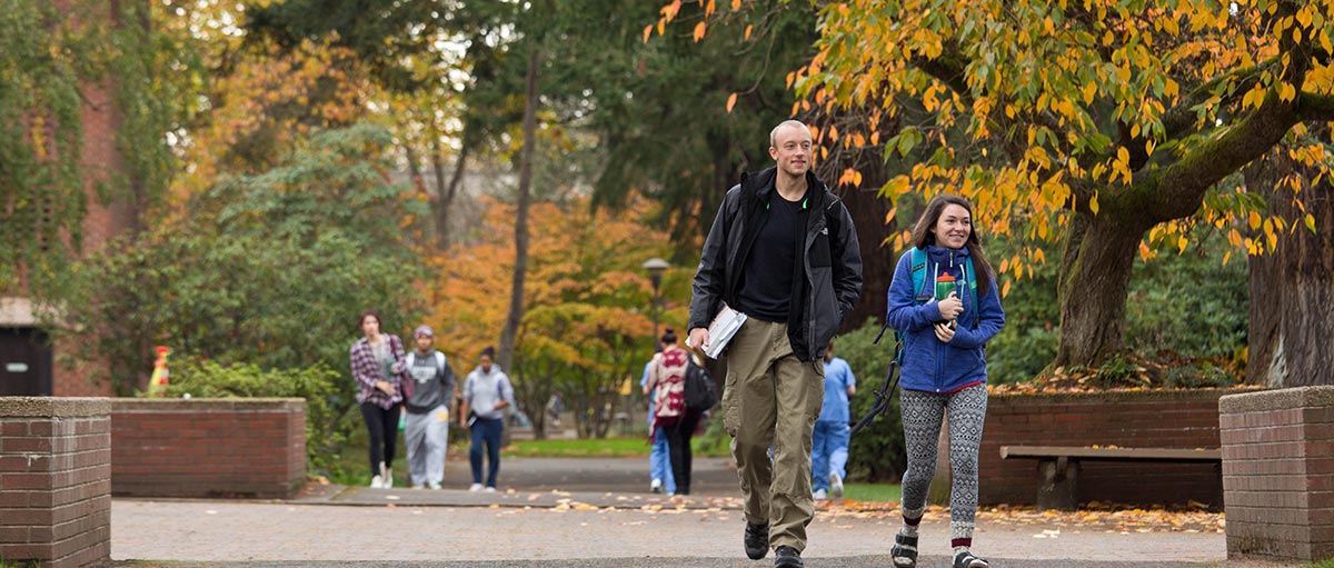 PLU students walk to class on a fall day.