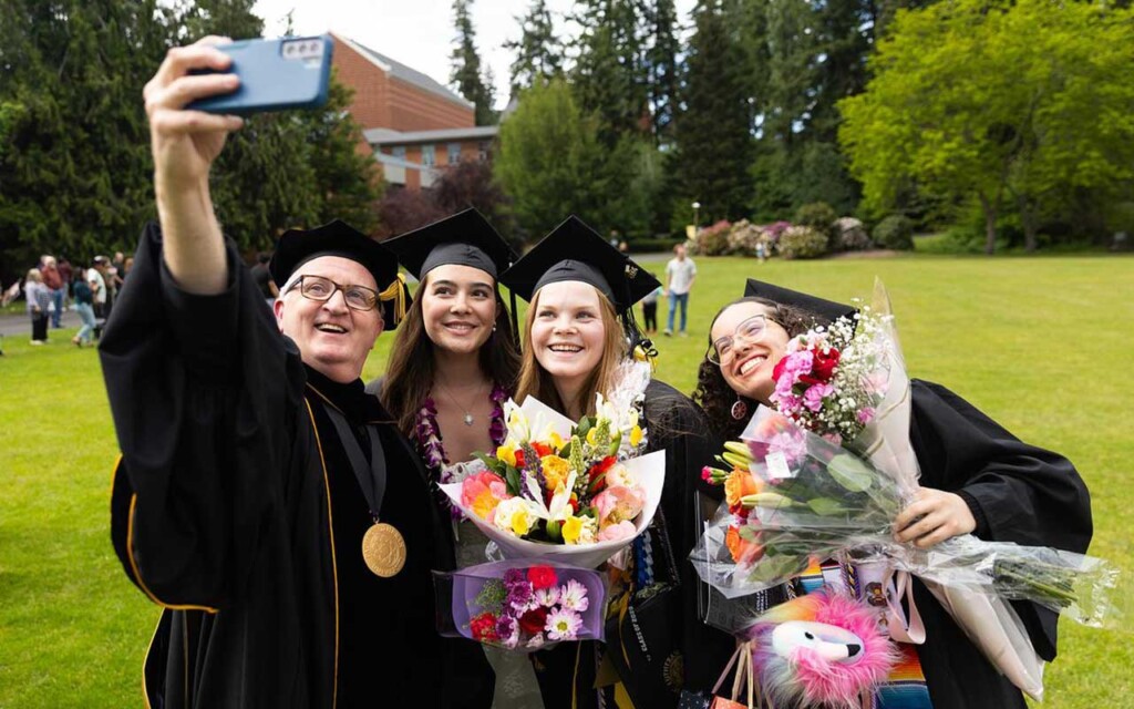 PLU President Allan Belton taking a selfie with new PLU graduates at PLU's Commencement. PLU President Allan Belton taking a selfie with new PLU graduates at PLU's Commencement.