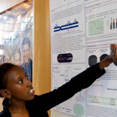 A student presents her research.