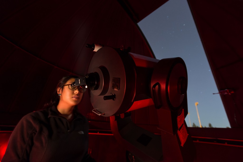Kimberly Belmes Kimberly Belmes '18, adjusts the telescope on Saturn for viewers during the Tacoma Astronomical Society and the Physics Dept. opening the Keck observatory for guest to look at the night sky after the Jazz Under the Stars concert at PLU, Thursday, Aug. 11, 2016.