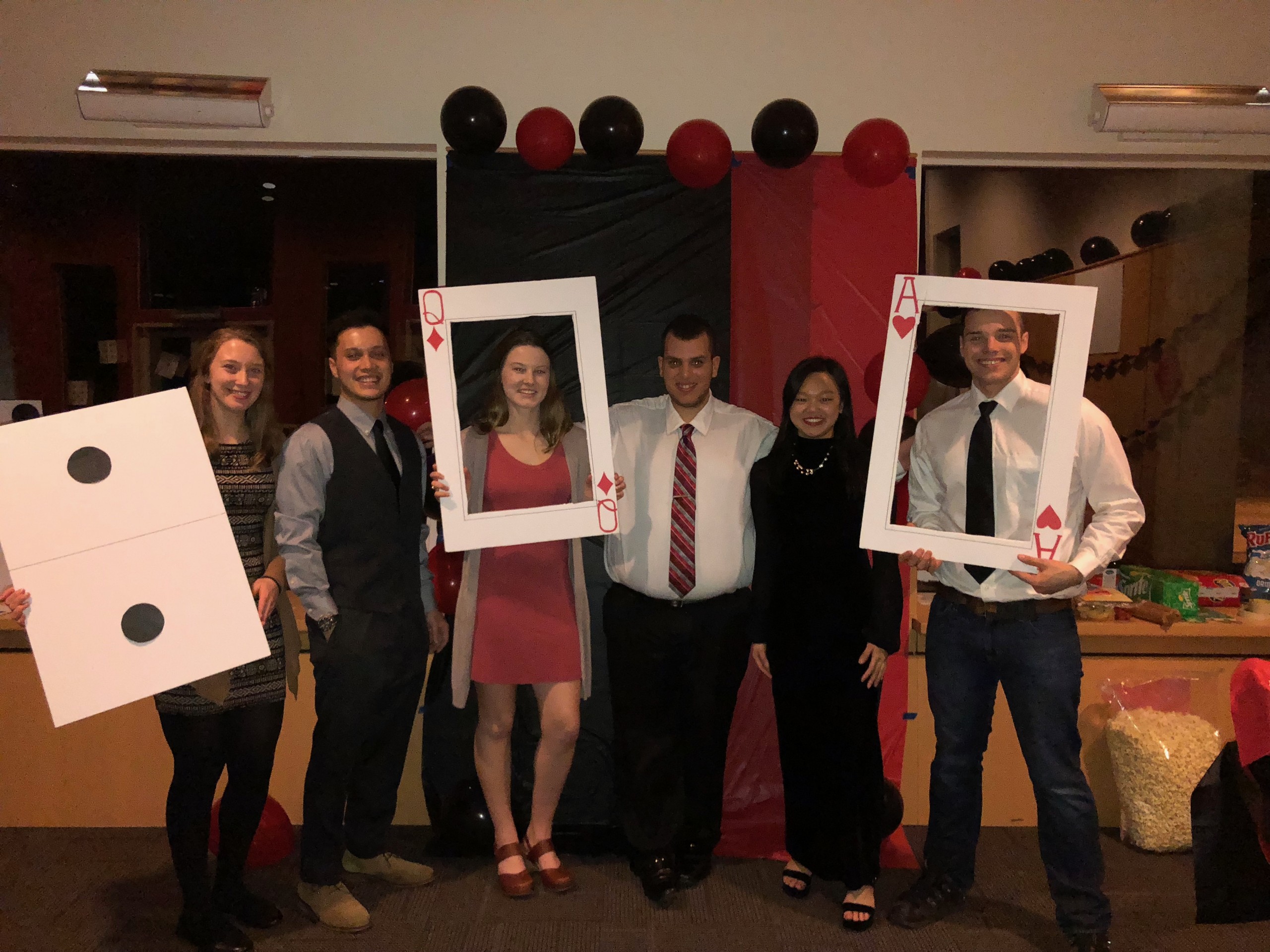 Casino Night, people posing with frames that look like cards