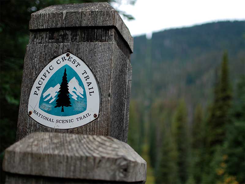 Pacific Crest Trail sign on a wooden post