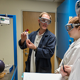 Dean Waldow explaining to his students his idea for a better battery