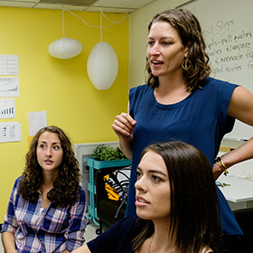 Shannon Seidel with two students doing summer research