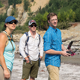 Tarka Wilcox controlling a drone with his two students