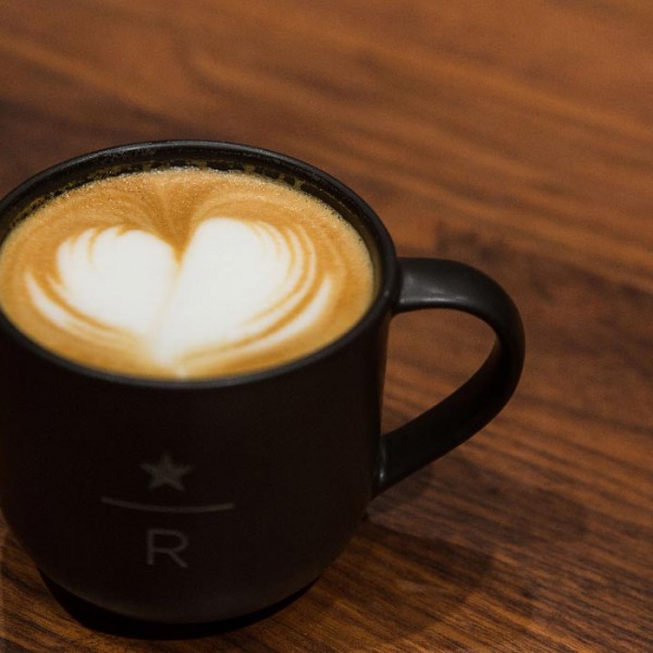 A latte with a heart formed in the middle of the cream