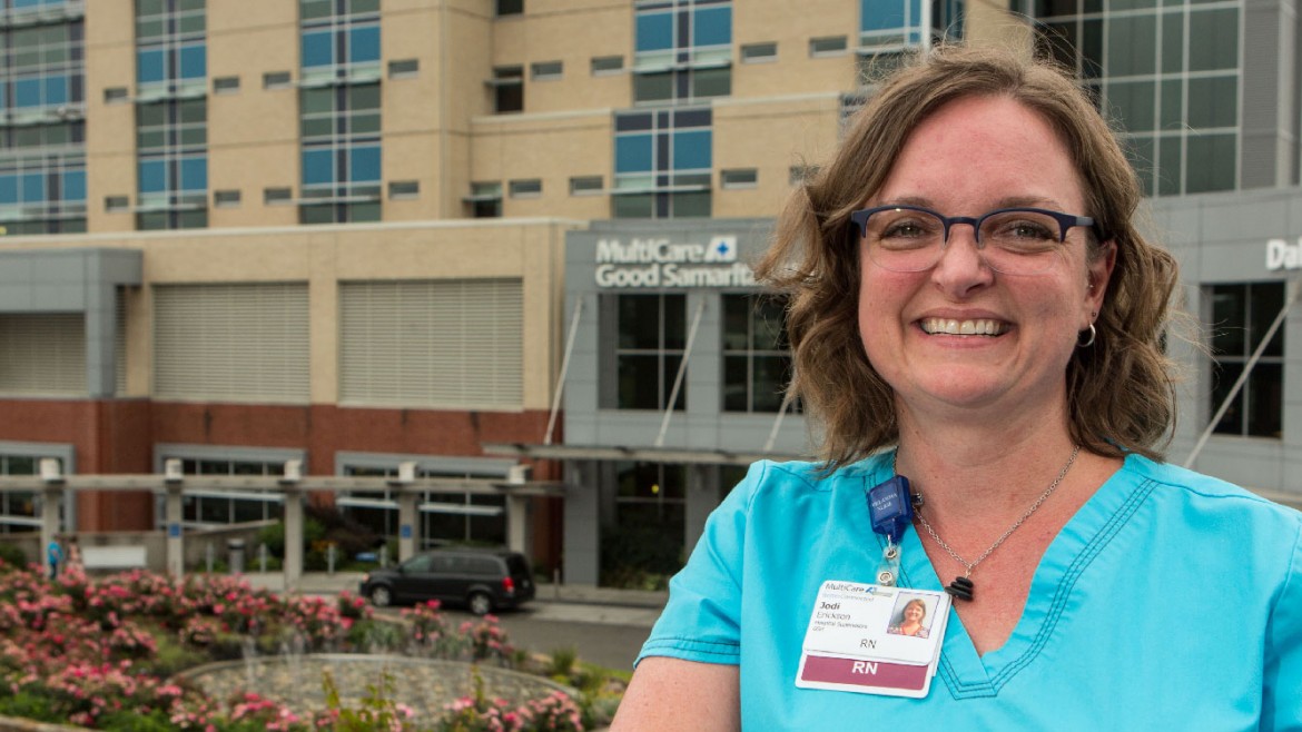 Jodi Erickson standing in front of the MultiCare Good Samaritan hospital in Puyallup, WA