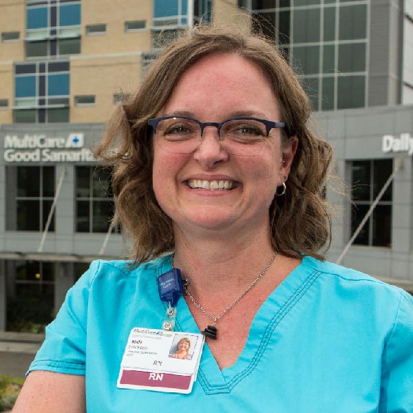 Jodi Erickson standing in front of the MultiCare Good Samaritan hospital in Puyallup, WA