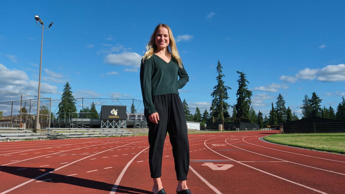 Andrea Adams '15 standing on the track at PLU