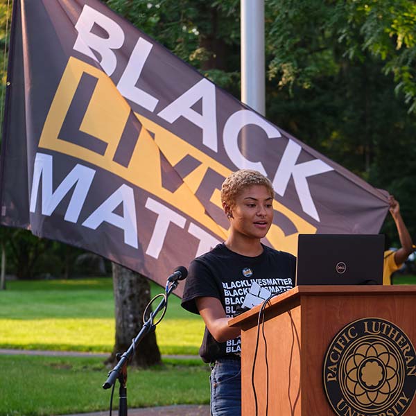 PLU student raises Black Lives Matter Flag on Red Square