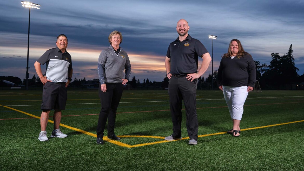 Jennifer Thomas interim AD, Jennifer Childress, assistant AD, Brant McAdams, football head coach and Kevin Akoi, volleyball head coach