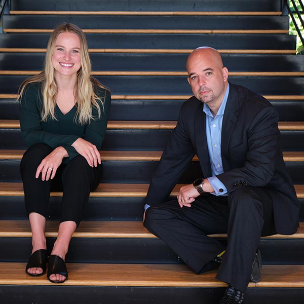 Andrea Adams and Bradd Busick sitting on some stairs