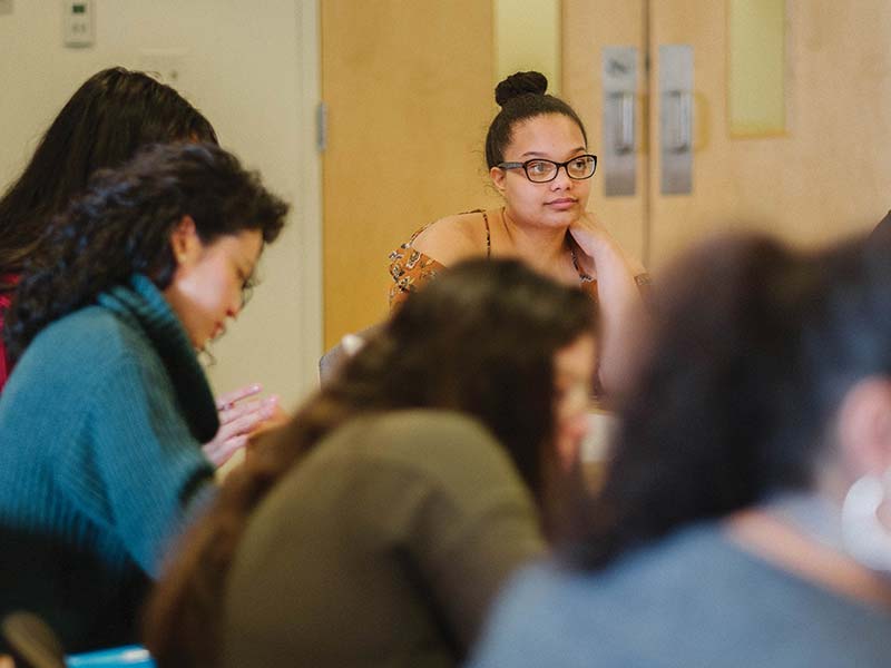 A member of the Sista Circle listening to the group