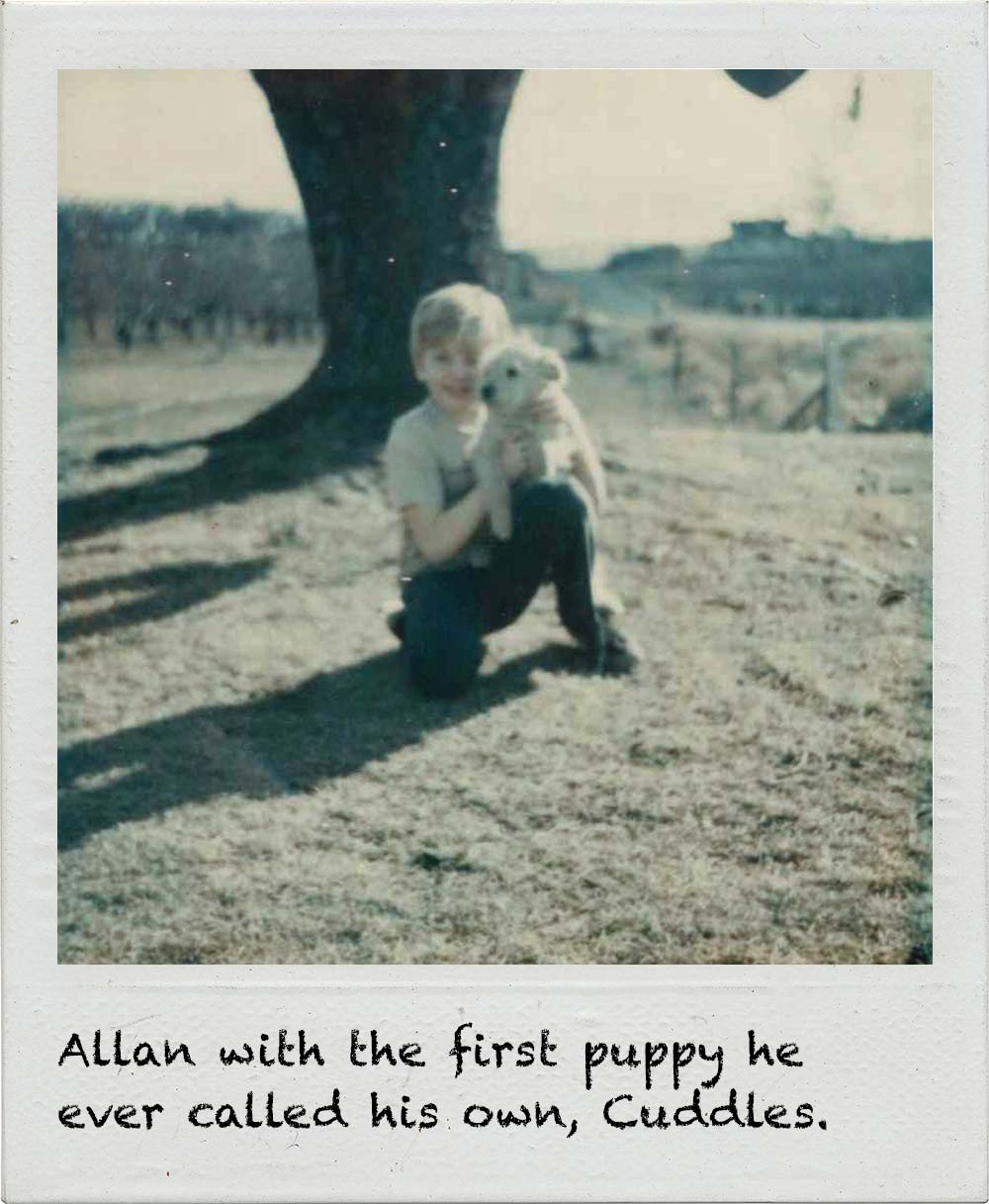 Allan with the first puppy he ever called his own, Cuddles.
