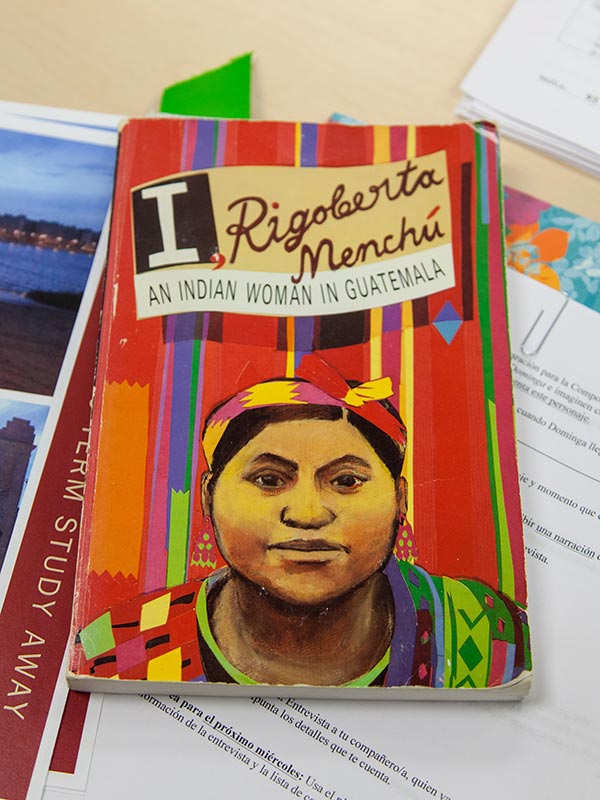A book is pictured, titled "I, Rigoberta Menchú: An Indian Woman in Guatemala"