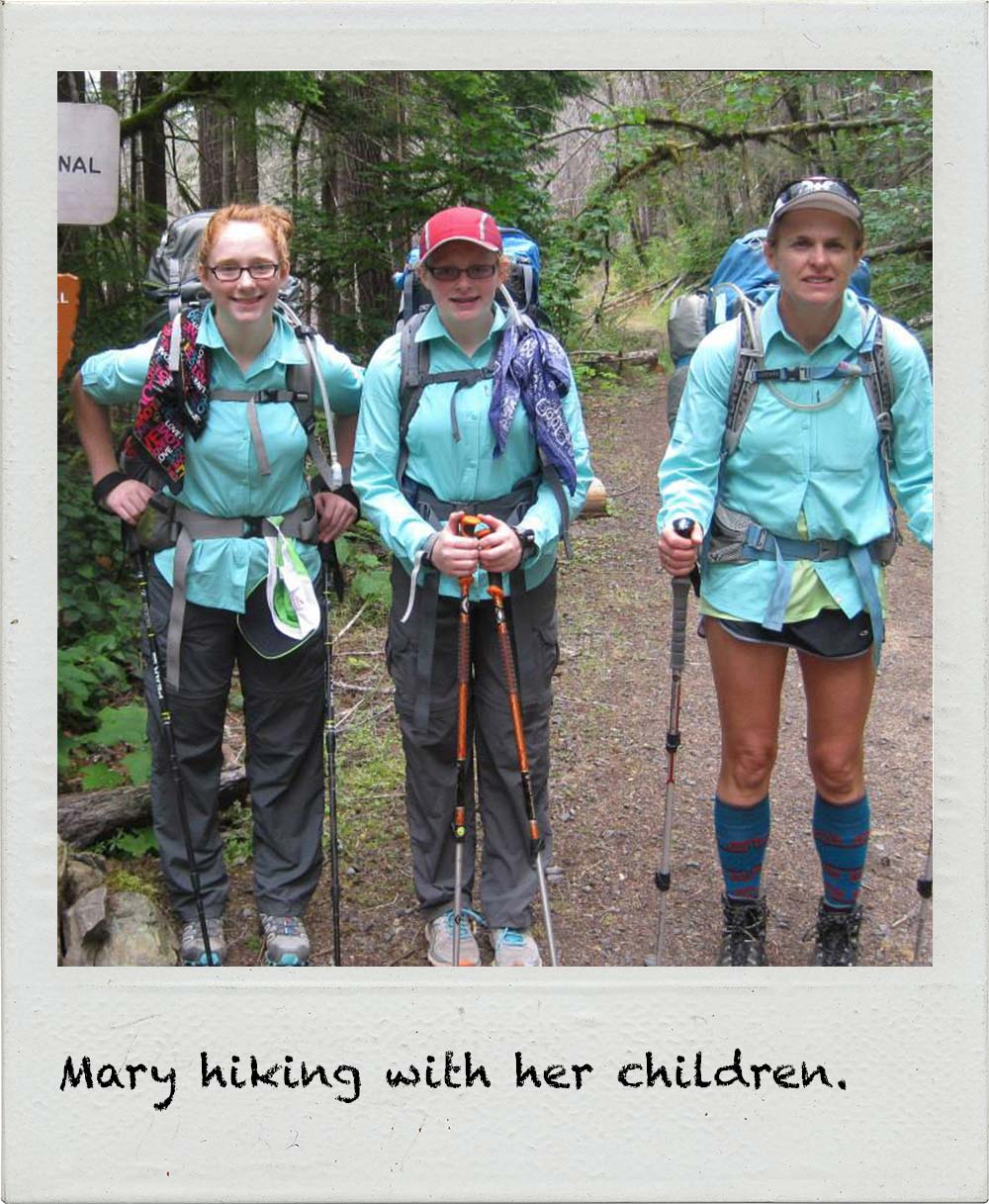Mary hiking with her children.