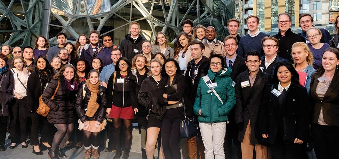 PLU students and alumni pose for a picture outside Amazon headquarters
