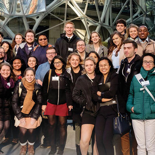 PLU students and alumni pose for a picture outside Amazon headquarters