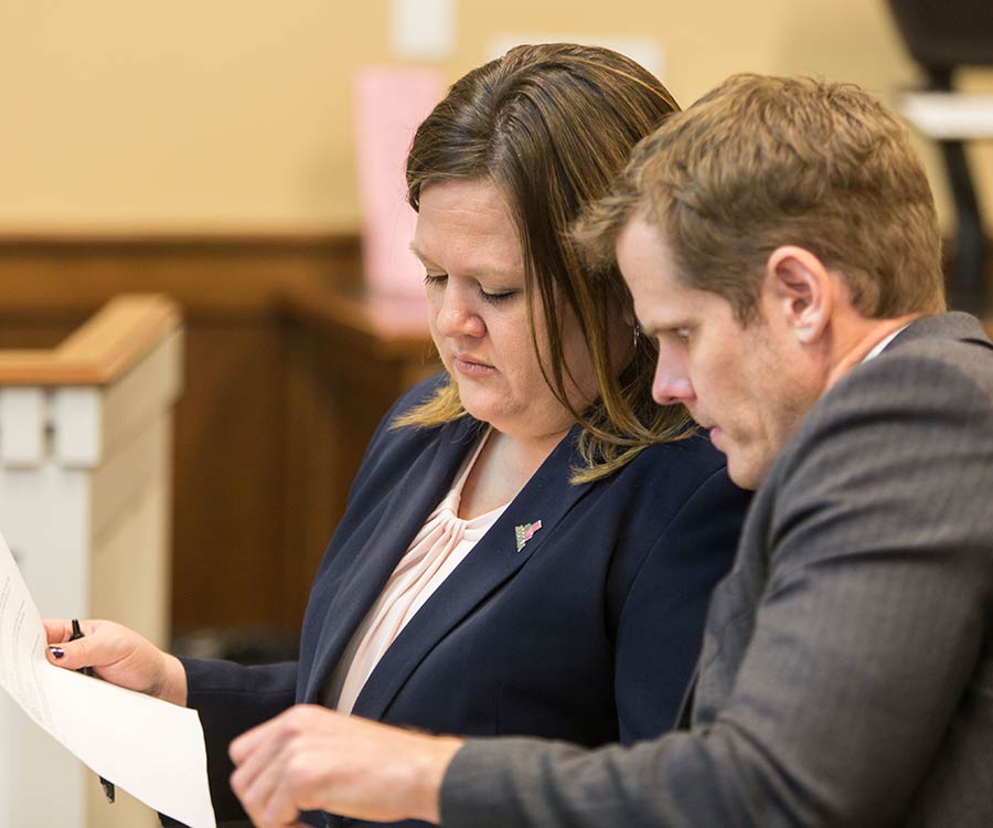 Tara Simmons looking over her documents in the courtroom
