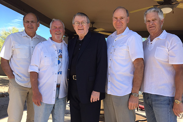 The five friends pose for a photo before heading home after their visit to Scottsdale, Arizona. ``The four of us in white and Doug in black can not be but metaphor of what has happened in our story,`` Sherry says. (Photo by Jonathan Nesvig '67)