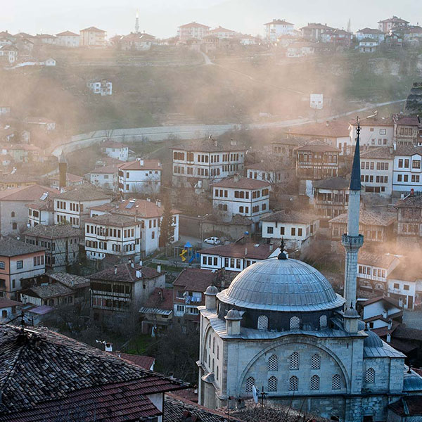 Clouds cover the buildings and town in a town in Turkey