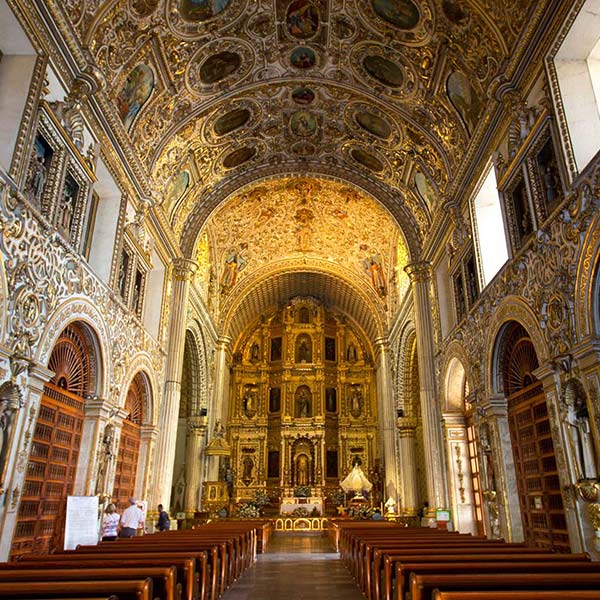 Inside a beautiful gold-colored Church in Oaxaca, Mexico