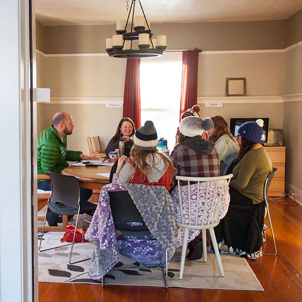 People gathered around a kitchen table
