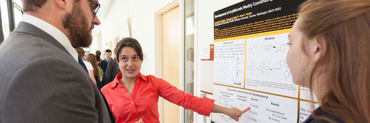 A woman pointing at a topic on a research board