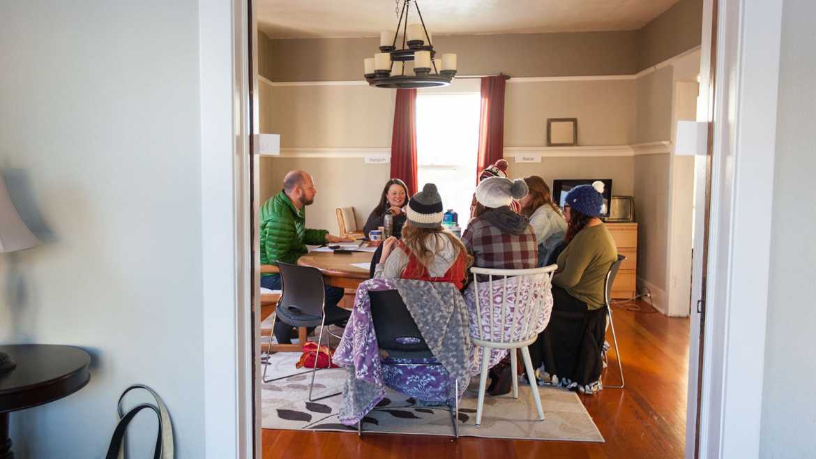 People gathered around a kitchen table