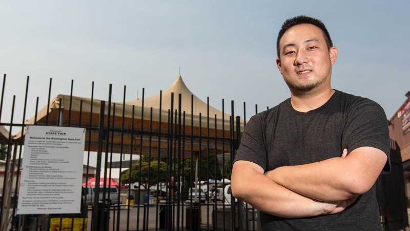 Stephen Kitajo standing in front of the Puyallup Fair