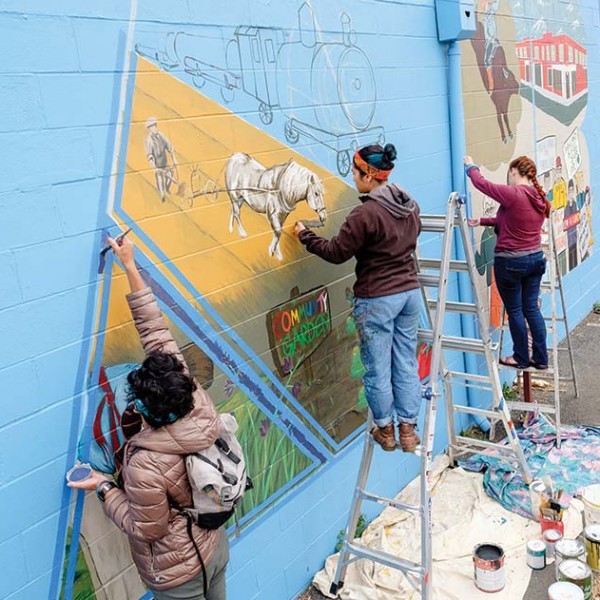 Originally painted on the side of the local Post Office several years ago, PLU volunteers this year re-painted parts of the mural that were destroyed after a car crash.