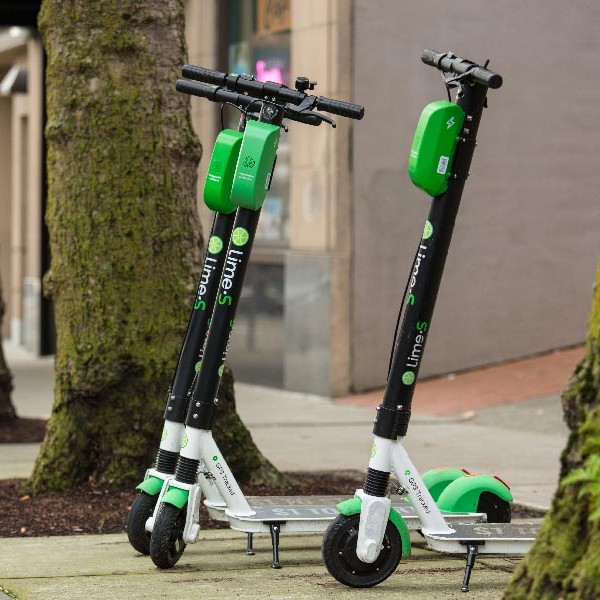 Kristina Walker, Executive Director of Downtown: On 1he Go, rides a lime bike in Downtown Tacoma