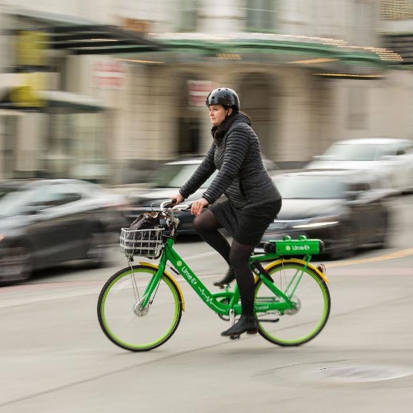 Kristina Walker, Executive Director of Downtown: On 1he Go, rides a lime bike in Downtown Tacoma