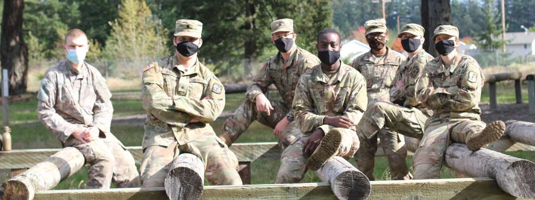 Cadets sitting at rope course event during Lute Forge